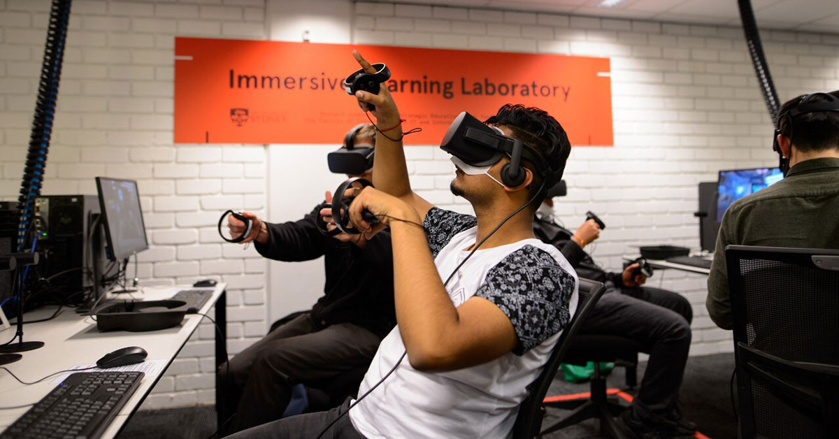 Student pointing up while using virtual reality headset