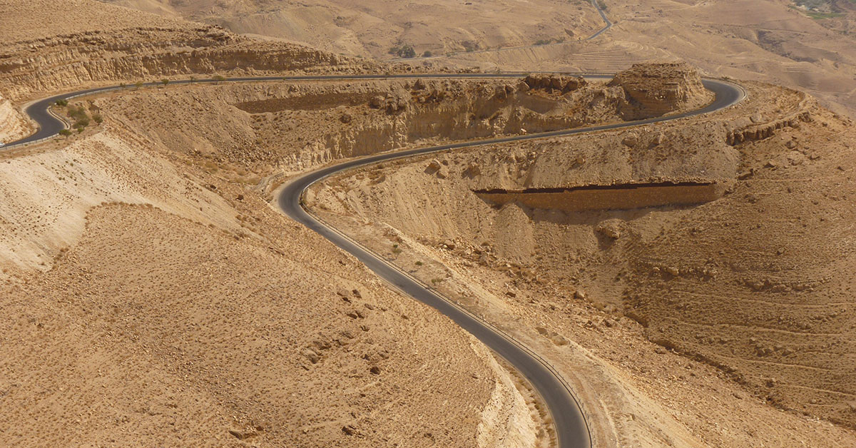 Winding road through desert